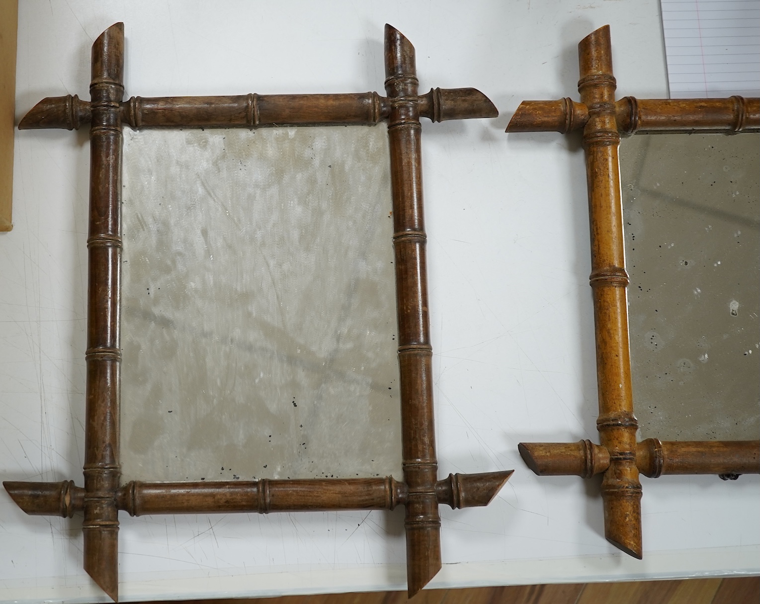 A near pair of small French faux bamboo wall mirrors